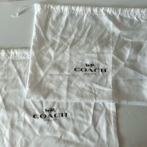Two Coach storage/dust bags